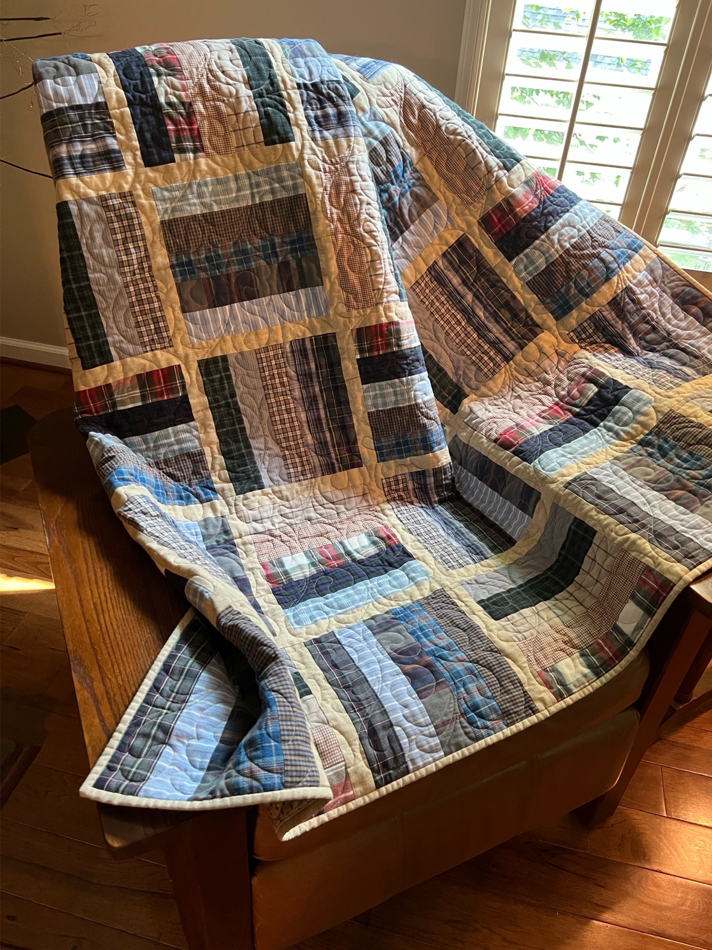 photo of a quilt made from Tom's old shirts